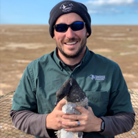 Josh Stiller holding a duck